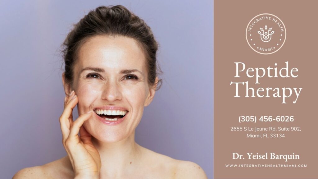 A woman with a joyful expression rests her hand on her face, symbolizing the impact of peptide therapy on her health.