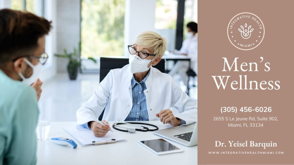 A healthcare professional in a white coat and mask consults with a male patient, emphasizing Men's Wellness.