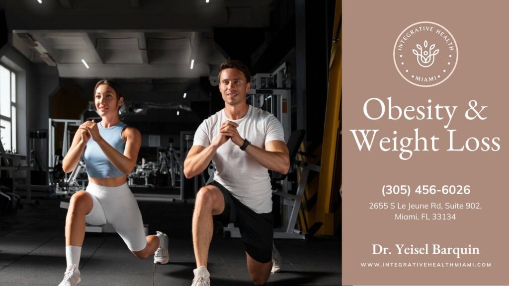 A couple working out with squats in a gym setting, highlighting physical activity as a component of obesity & weight loss.