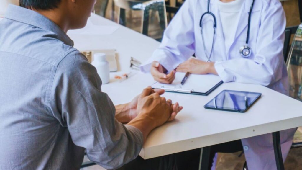 Men’s wellness consultation in Aventura, FL with a provider and patient discussing personalized care, preventive wellness, and health goals.