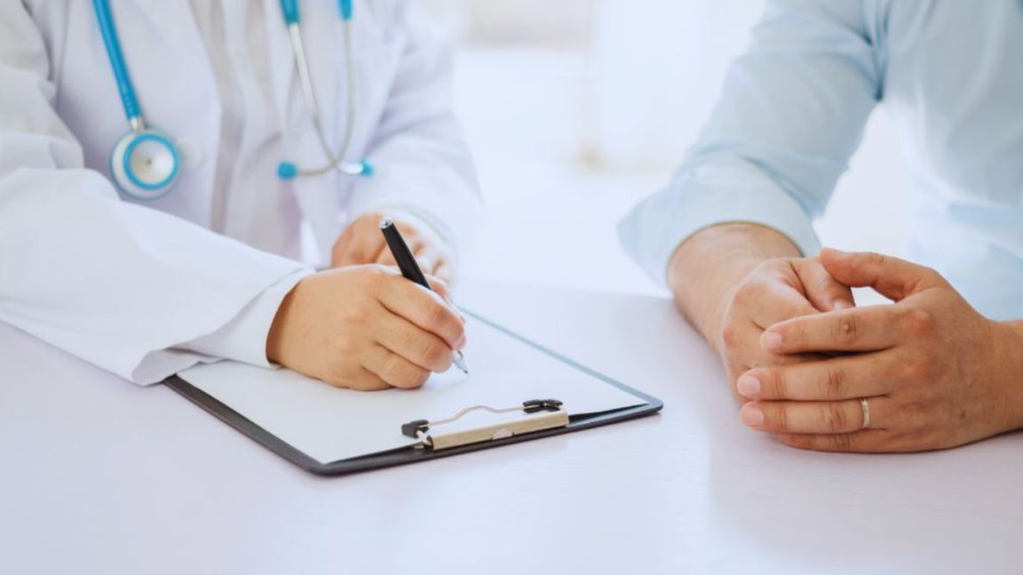 Provider consulting with a male patient about personalized men’s wellness and preventive care.