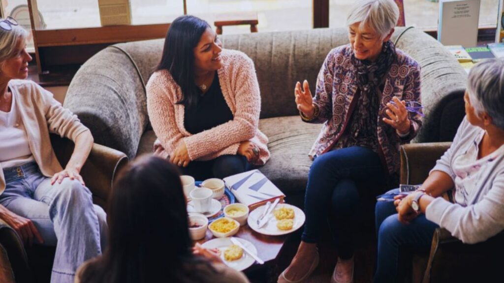 Women participating in a supportive women’s wellness discussion in Aventura, FL, focusing on holistic health, emotional well-being, and preventive care.